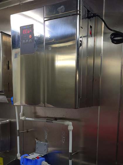 EcoloxTech E-300 hypochlorous acid generator mounted on a bulkhead aboard a cruise ship, with pre-filter and dosing line